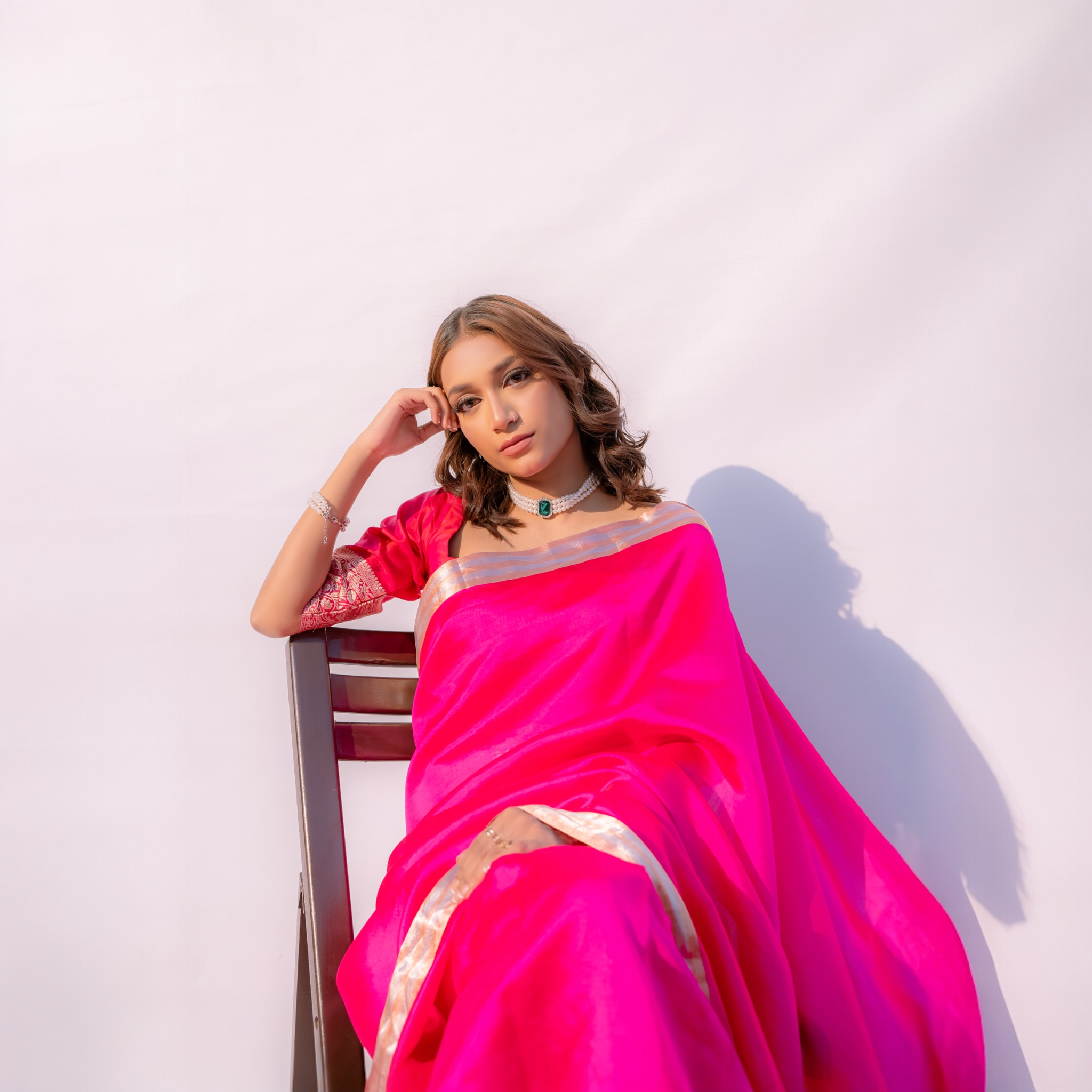 Model is wearing pure handloom royal pink banarasi saree of lunarae london.