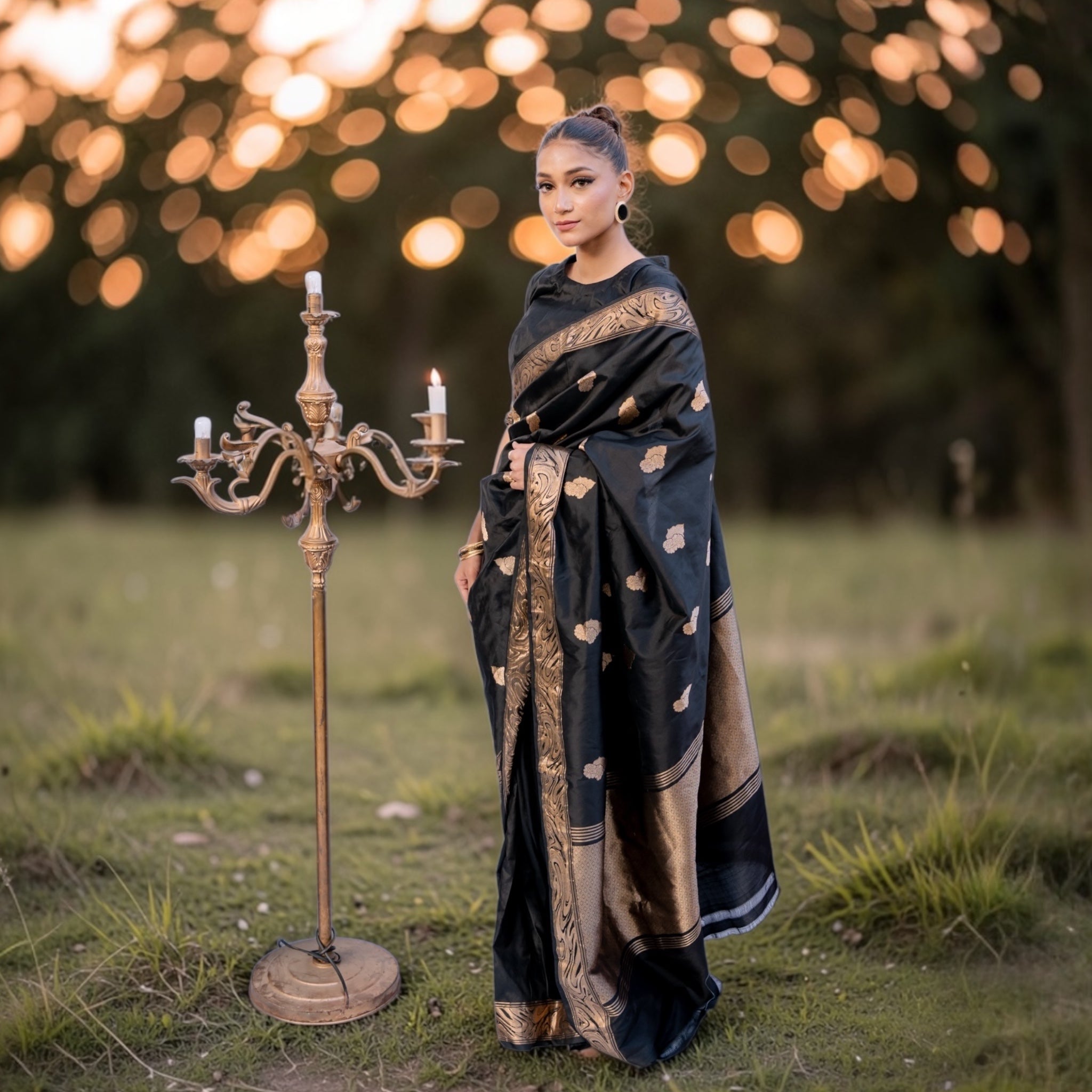 Model wearing Black Pure Katan silk Banarasi saree with golden floral motifs from Sacred Ties collection